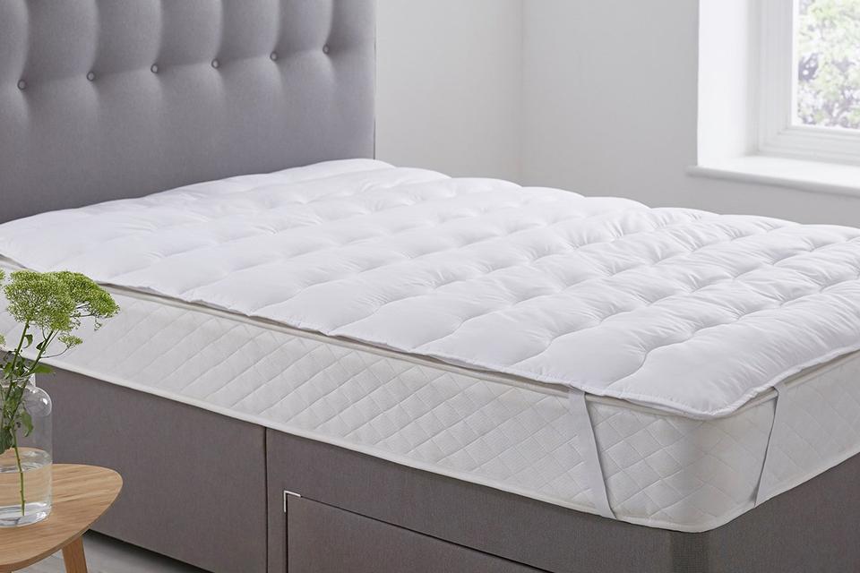A thin mattress pad