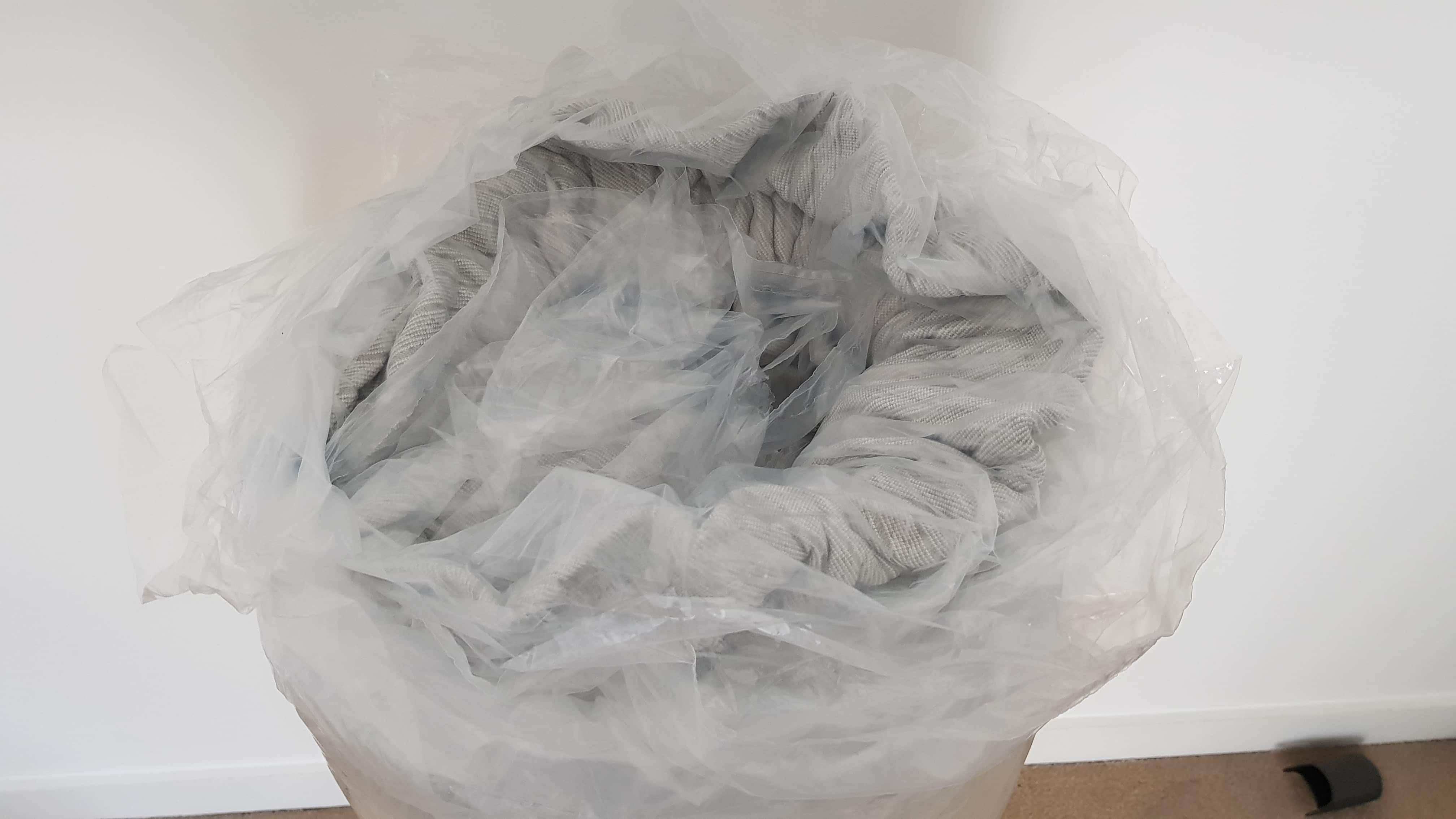 Plastic cover of a rolled up Leesa mattress