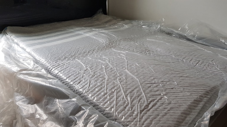 Leesa mattress still in its vacuum packaging