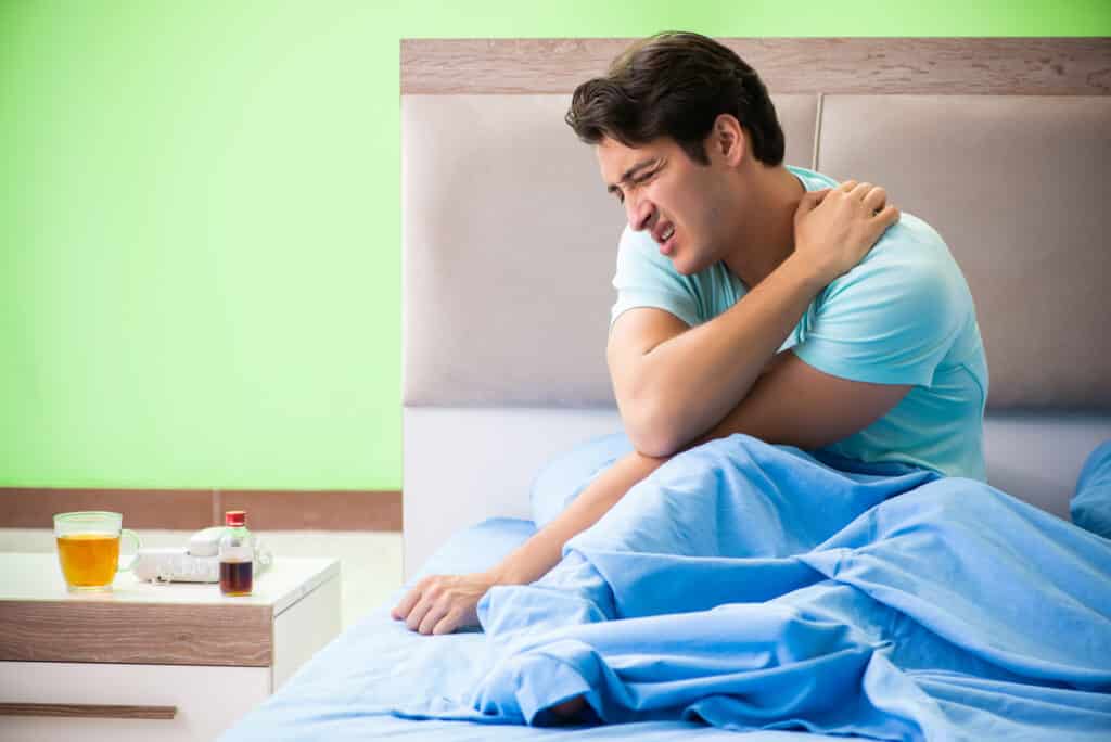 Man suffering from shoulder pain in the morning