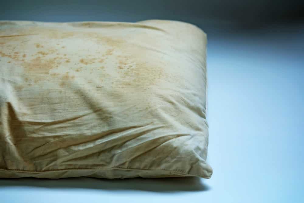 Pillow with yellow stains